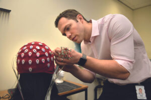 Dr Will Sedley working in his laboratory.