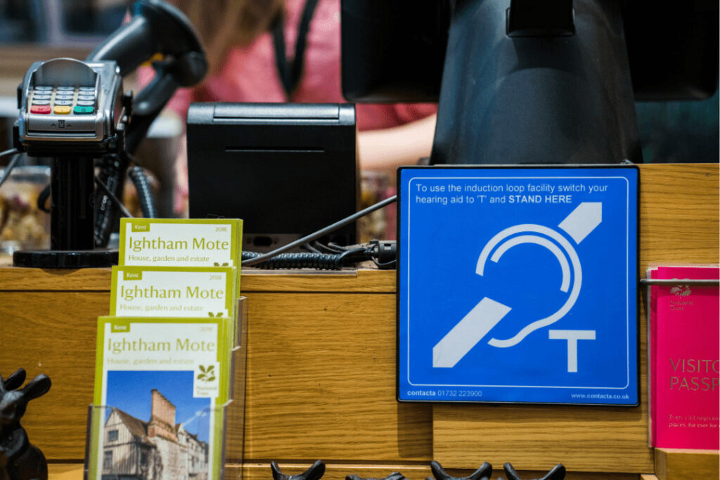 A picture of a hearing loop symbol, featured at a till point in the National Portrait Gallery.