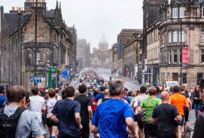 Runners running through a city street