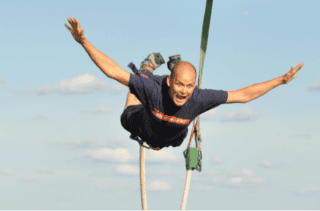 A man falling on a bungee jump
