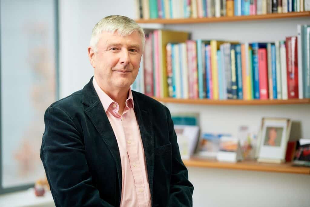 Tom Denning, hearing aid user, in his home office