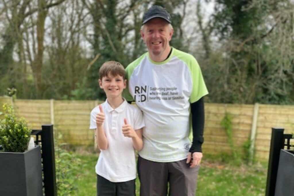 Neil wearing a London Marathon RNID Tshirt with his son Noah.