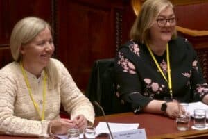 RNID staff, Teri Devine and Mariette Mulvenna giving evidence to N Ireland Committee for Communities